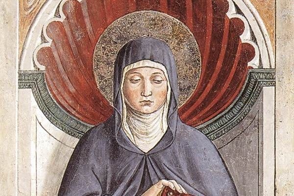 A fresco panel of St. Monica, an older woman in a dark habit and white veil, standing with hands folded in prayer against a gold-toned background.