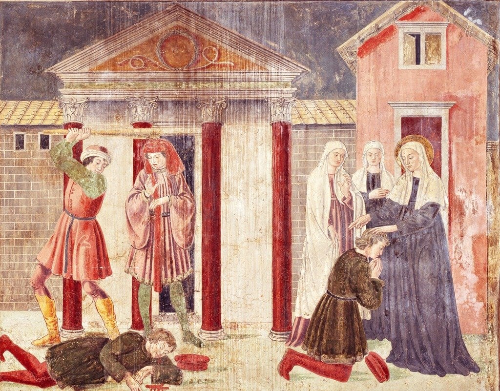 A painted fresco of a Roman street with classical columns: St. Frances of Rome, with a halo and a veil, lays her hand on the head of a kneeling young man, while a companion nun and other women look on, and at left a man lies fallen with another standing over him with a staff.