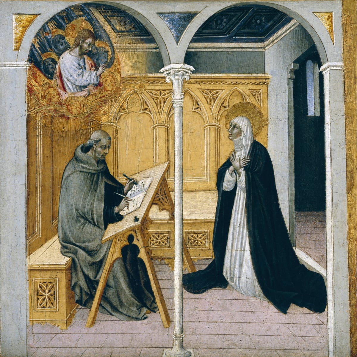 A painted scene in a Gothic loggia: a haloed nun in black and white Dominican habit stands at right, hands clasped at her breast, speaking toward a tonsured friar seated at left who writes on a sloped desk; above them, in a golden mandorla, Christ appears with attendant figures.