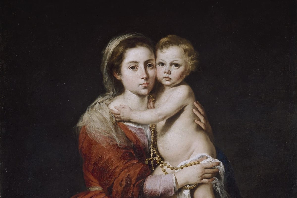 A half-length painting of the Virgin Mary in a red robe and blue mantle, cheek to cheek with the infant Christ Child, who holds a gold rosary.