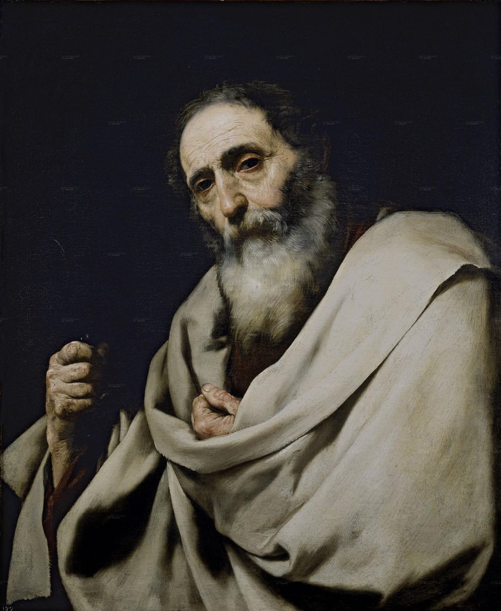 An elderly bearded apostle in a pale cloak draped over a dark red robe grips a knife in one hand against a plain black background, gazing out at the viewer.