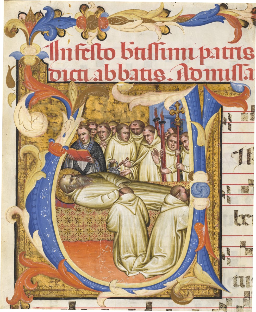 St. Benedict dies upright in the oratory, held up by his brethren, in an Italian panel of about 1390 AD.