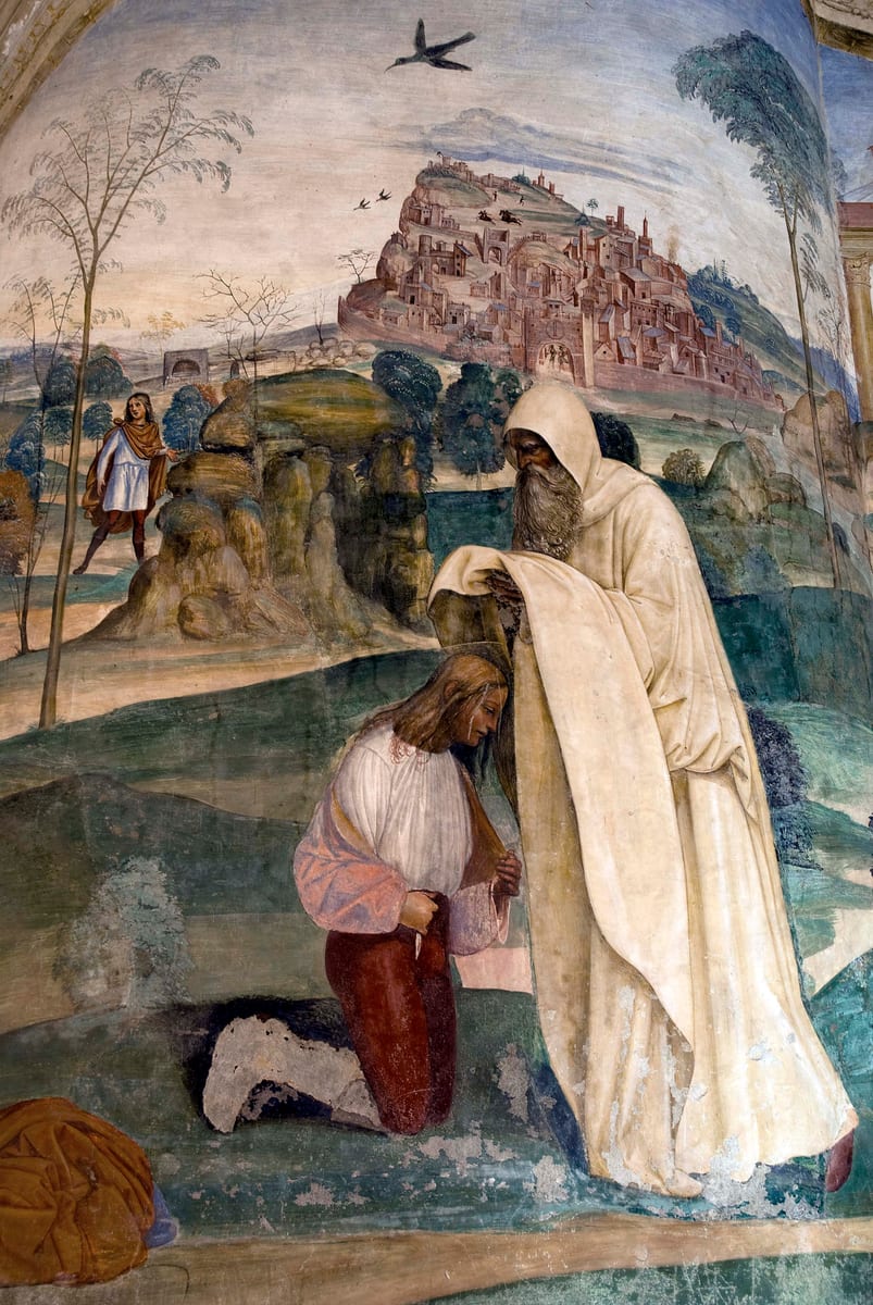Saint Romanus gives the monastic habit to a young St. Benedict at the mouth of the cave above Subiaco.