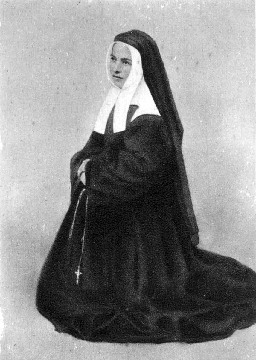 A photograph from the 1870s AD of her as Sister Marie-Bernard at Nevers, in the dark habit, white coif and black veil of the Sisters of Charity.