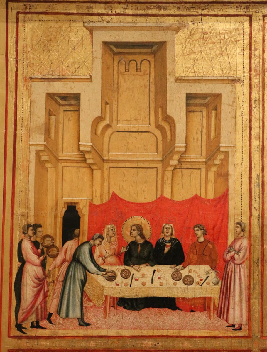 Saint Cecilia sits at the wedding table beside St. Valerian among the guests in an open-sided hall, with the hired musicians playing at the far side of the room.