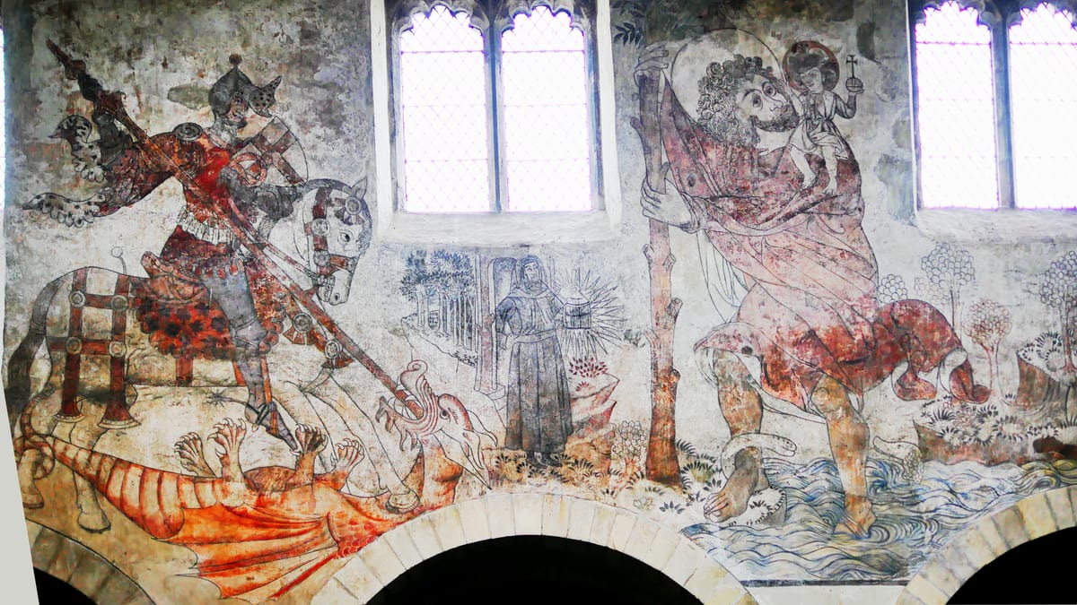 A medieval English wall painting of Saint Christopher beside Saint George and the dragon on the north wall of a parish church.