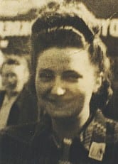 A small photograph of St. Faustina before she entered the convent, in secular dress with her hair uncovered and dressed in the manner of a Polish working girl of the early 1920s.