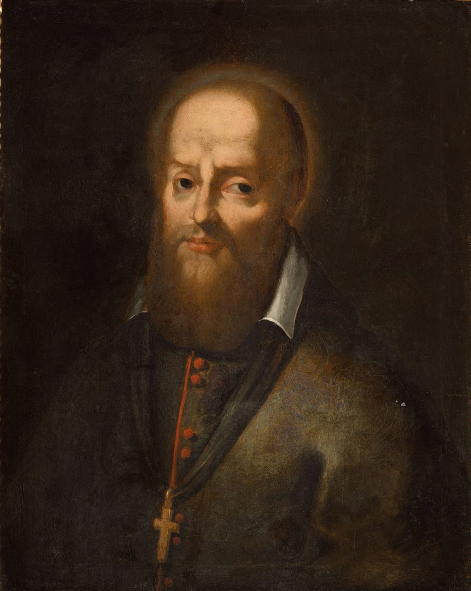A half-length portrait of a balding, bearded bishop with a faint halo, wearing a dark cassock with red buttons, a white collar, a stole, and a pectoral cross on a rosary, against a dark background.