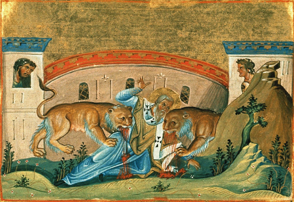 A Byzantine manuscript miniature shows two lions attacking the white-bearded St. Ignatius in an amphitheatre under a gold sky.