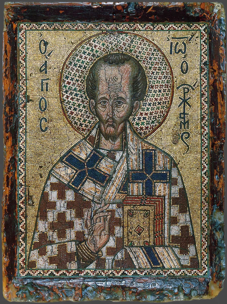 A fourteenth-century Greek micromosaic icon shows Saint John Chrysostom worn to the bone, with an enormous bald forehead, fallen cheeks and a thin grey beard, holding the Gospel book with his hand raised in blessing.