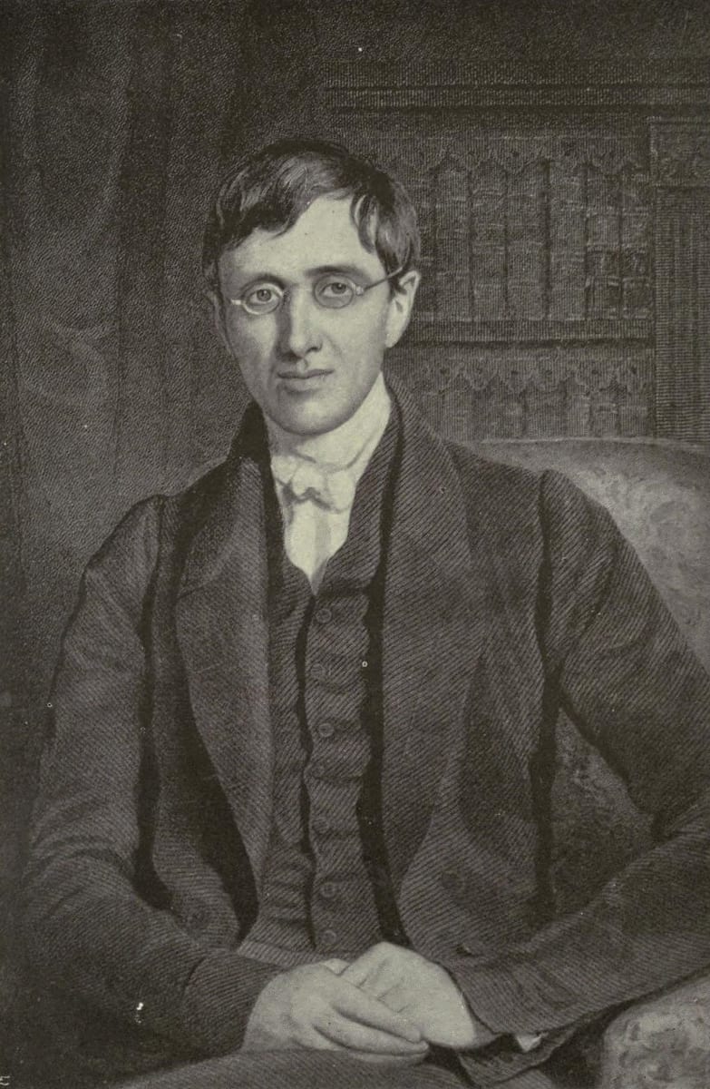A miniature portrait of St. John Henry Newman seated in an upholstered armchair before shelves of leather-bound books, his hands loosely clasped in his lap.