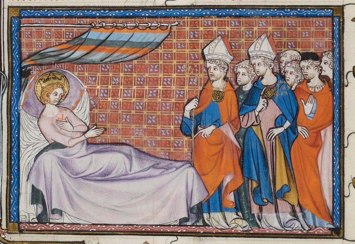 A crowned, haloed king sits up in bed with a small red cross on his shirt, while two mitred bishops and a crowd of courtiers stand at the bedside.