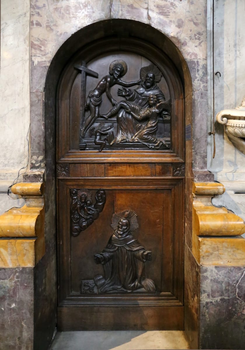 A painted door shows St. Peregrine Laziosi in the black Servite habit standing beside Blessed Francesco da Siena.