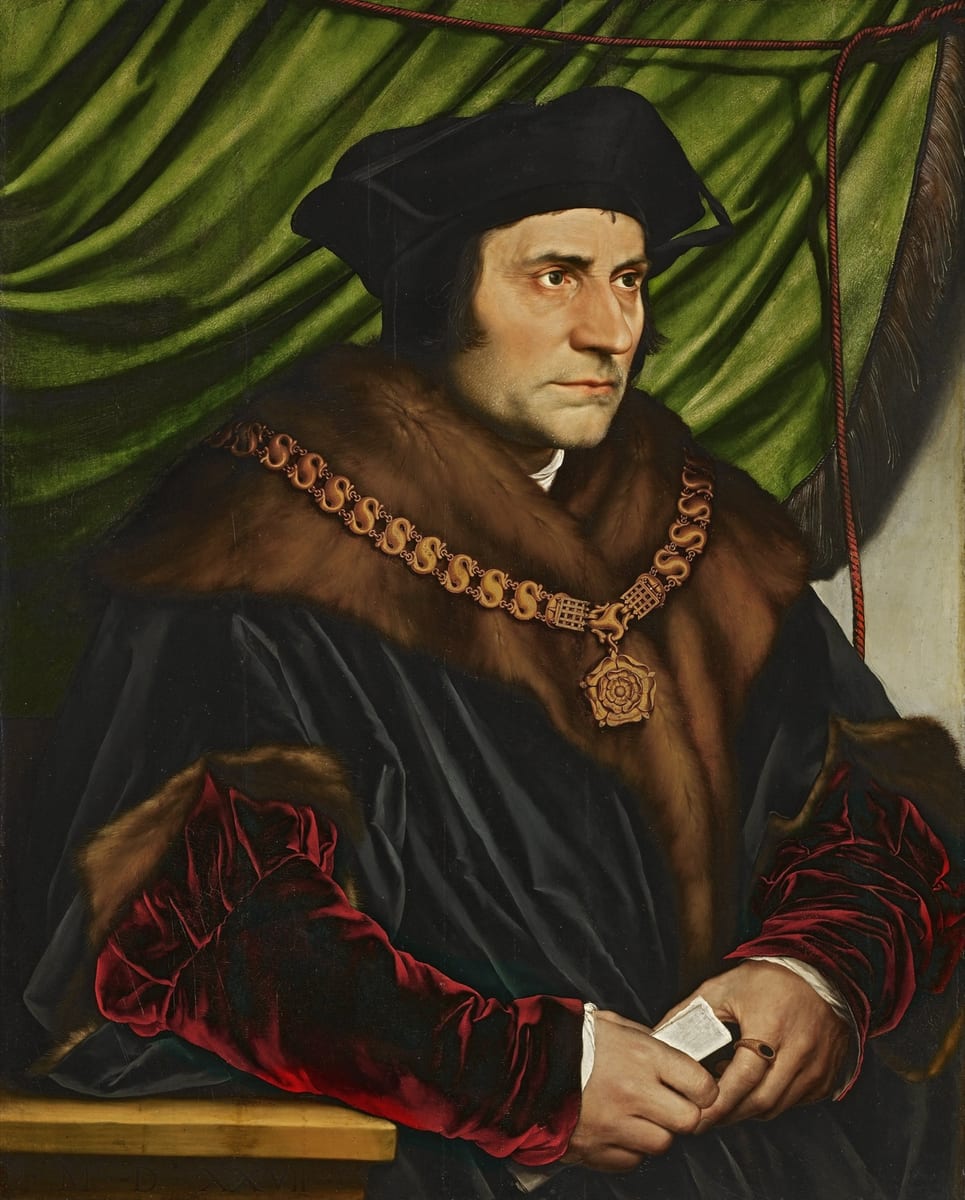 A half-length portrait of a bearded man in a black cap and fur-trimmed black robe with red velvet sleeves, wearing a gold collar of esses and holding a folded paper against a green curtain.