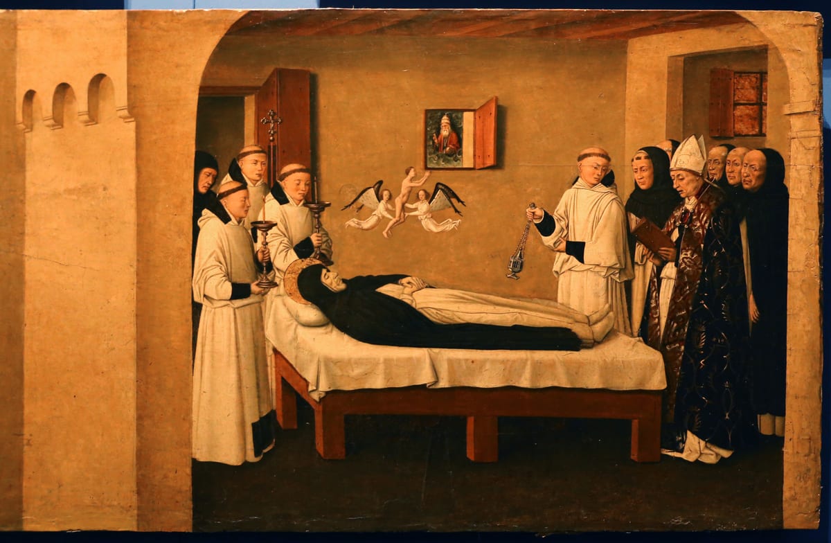 A friar in the Dominican habit lies dying on a low bed in a chamber, surrounded by friars, clergy and townspeople.
